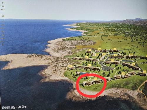an aerial view of an island with a red circle at Beachfront Penthouse with beautiful view in North Cyprus in Küçükerenköy