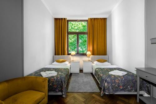 Posteľ alebo postele v izbe v ubytovaní Antique Apartments Old Town