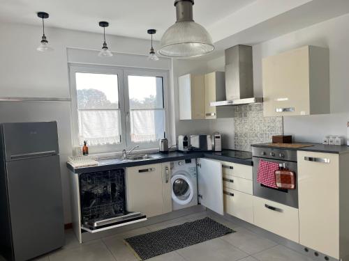 a kitchen with a washer and dryer in it at CasaNobile - Suite Il Grano in Merate