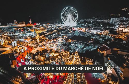 a pyongyang dur market de noel at night with a ferris wheel at Tropic Hôtel in Rivesaltes