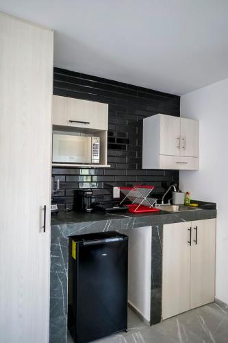 Η κουζίνα ή μικρή κουζίνα στο Lofts Arsénico