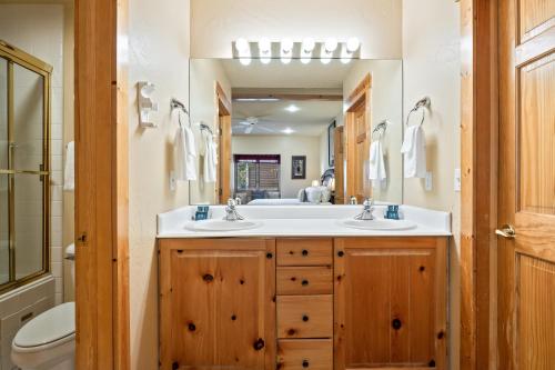 a bathroom with two sinks and a large mirror at Glenfiddich Condo, Deer Valley Resort, Cozy Interiors, Private Patio, Private Hot Tub, Stunning View in Park City