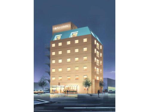 a tall building with a blue roof at Ichinomiya Green Hotel - Vacation STAY 89002v in Ichinomiya