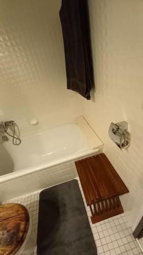a bathroom with a toilet and a sink and a window at Ferienwohnung Eule in Schönwald