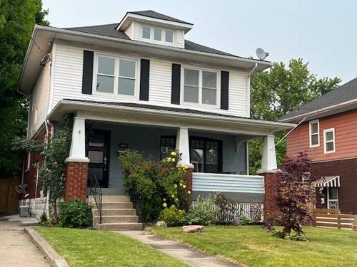 a black and white house with at Luxury and comfy Home- Niagara getaway in Niagara Falls