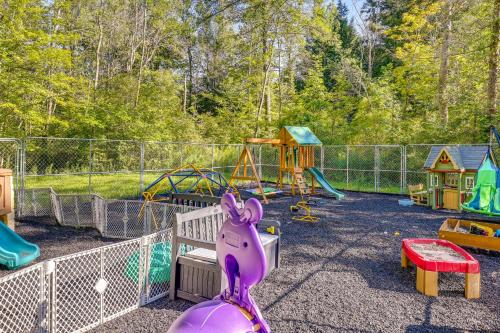 a playground with a purple toy rabbit on a slide at Family-Friendly Newfield Studio 9 Mi to Ithaca! in Newfield