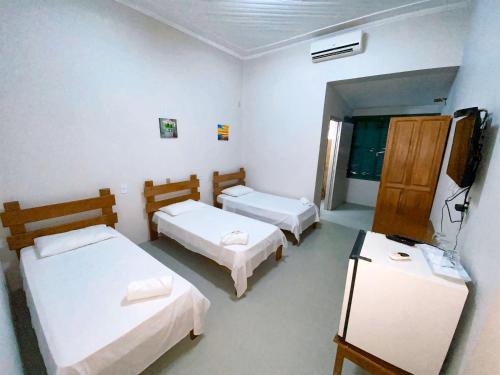 Ένα ή περισσότερα κρεβάτια σε δωμάτιο στο Portal Pantaneiro Hotel
