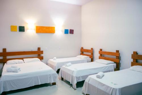 Ένα ή περισσότερα κρεβάτια σε δωμάτιο στο Portal Pantaneiro Hotel