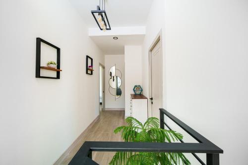 a staircase in a house with a black railing at Dili Dream Villa in Dilijan