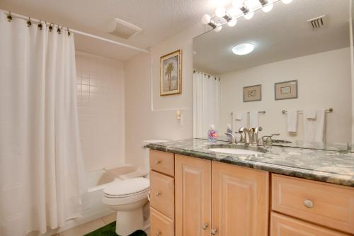 a bathroom with a sink and a toilet and a shower at 3 Mi to Ocean Riverfront Apartment in Vero Beach! in Vero Beach