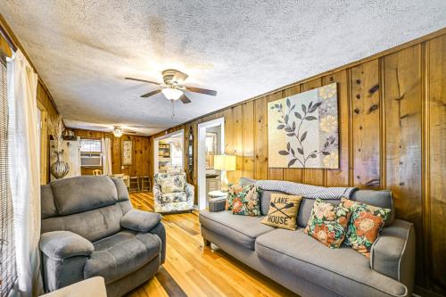 a living room with a couch and a ceiling fan at 1 Mi to Buchanan Resort Home with Deck and Yard! in Durham Subdivision