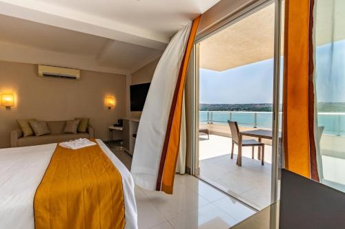 Cama ou camas em um quarto em eSuites Lagoa Santa