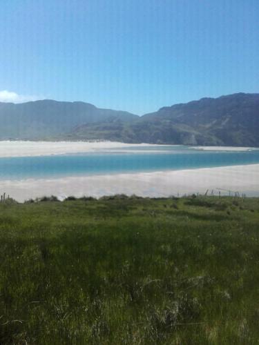 a large body of water with mountains in the background at Atlantic Coast in Ardara