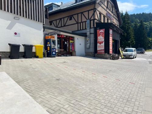 a parking lot in front of a gas station at SYNEK Pension in Špindlerův Mlýn