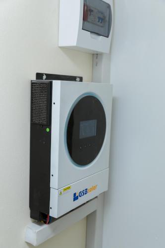 a microwave oven sitting on top of a wall at Luxe Oasis Villas - Lusaka in Kenneth Kaunda International Airport