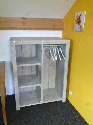 a white cabinet in a corner of a room at Vakantievilla Värmland, Zweden in Filipstad