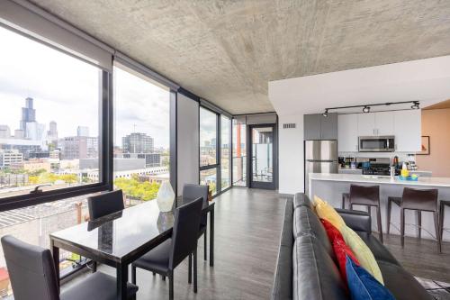 a living room with a couch and a table at Sophisticated 3BR Suite - New Modern and Luxurious in Chicago