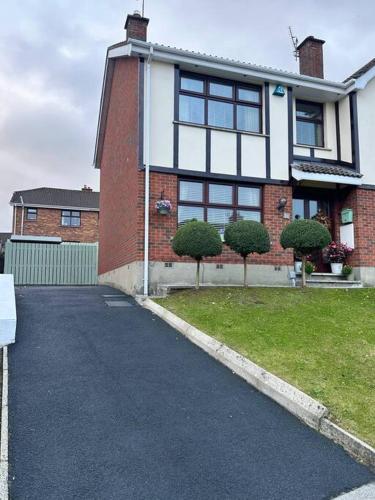 a house with a driveway in front of it at Royal Hillsborough Hideaway in Hillsborough