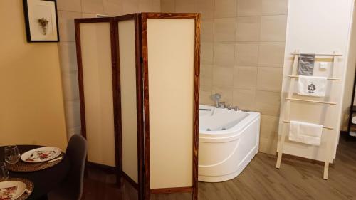 a bathroom with a toilet and a sink at Eden Spa Apartman in Arandjelovac