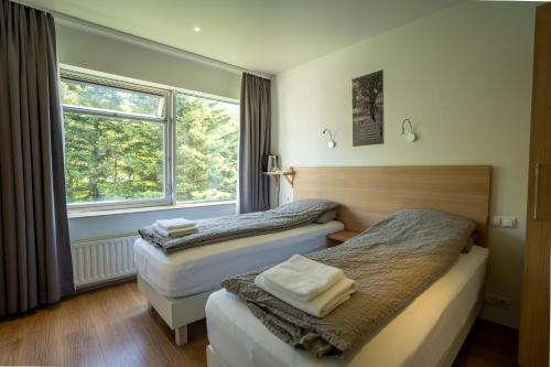 Postel nebo postele na pokoji v ubytování Hotel Eskifjörður