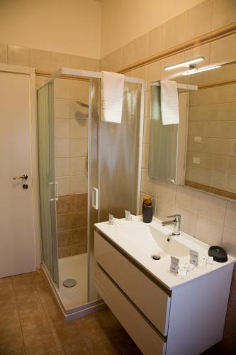 a bathroom with a sink and a shower at Le Floreali - Casa Salvia in Bolsena