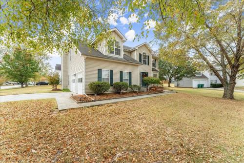 a house with a large yard in front of it at New 4 Bedroom Lithonia Home With Office in Lithonia