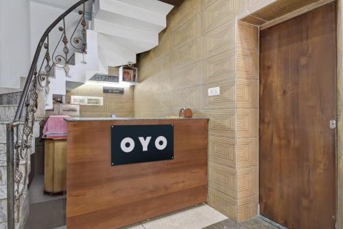 a sign that says ovy on a wooden counter in a room at Hotel O Indira in Jammu