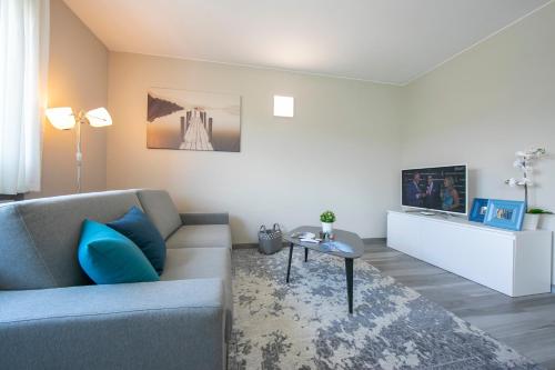 a living room with a couch and a table at Laguna di Lugano - Happy Rentals in Paradiso