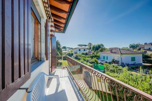 a balcony with a view of a city at Casa Vittoria 800m from sea - Happy Rentals in Forte dei Marmi