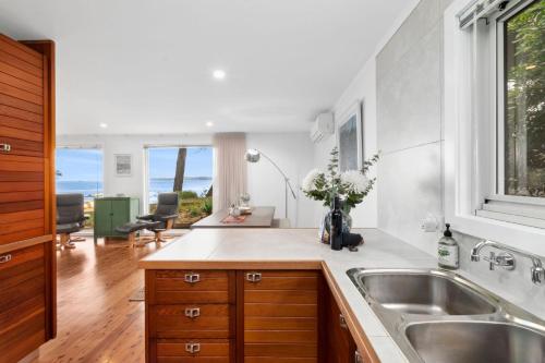 a kitchen with a sink and a counter top at Long Beach Hideaway in Long Beach
