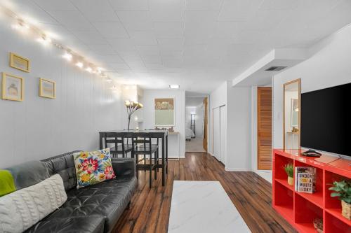 a living room with a couch and a table at Green Lake Zen Garden Basement in Seattle