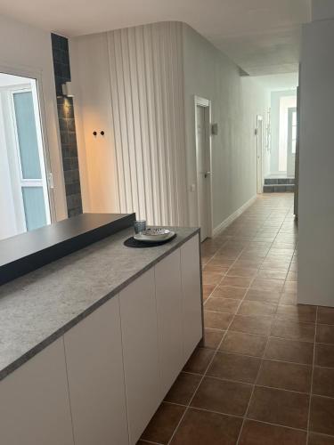 a kitchen with a counter top and a tile floor at Guest House Espinardo Murcia Casa Universitaria in Murcia
