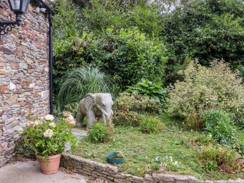 a statue of an elephant standing in a garden at Ballybeg Pod 7 in Arklow