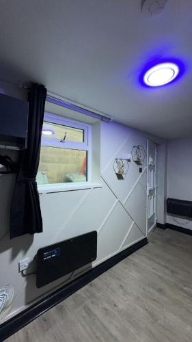 a room with a room with a window and a room with a room at Studio apartment in bolton town in Bolton