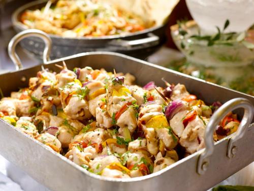 a casserole dish filled with chicken and vegetables at Olive Tree Hotel in Jerusalem