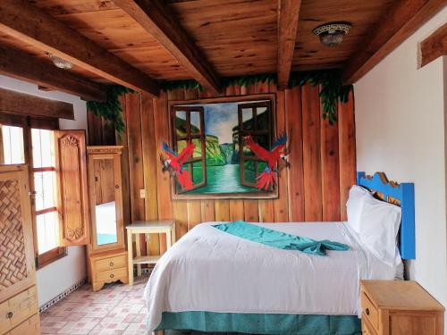 Postel nebo postele na pokoji v ubytování Hotel Tierra Maya