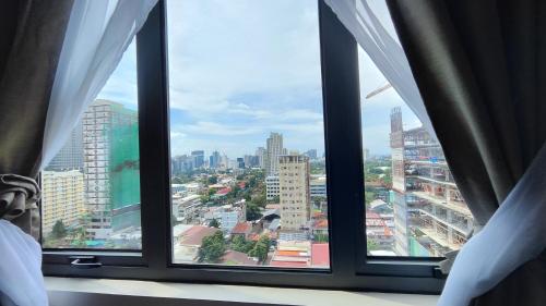 Nespecifikovaný výhled na destinaci Cebu City nebo výhled na město při pohledu z apartmánu