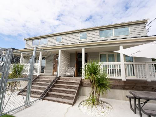 a house with a porch and a table at Tabist Pension Third Place in Ichinomiya