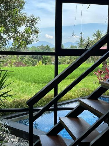 Jardín al aire libre en Maple Ridge Ubud Villas with Rice Field View