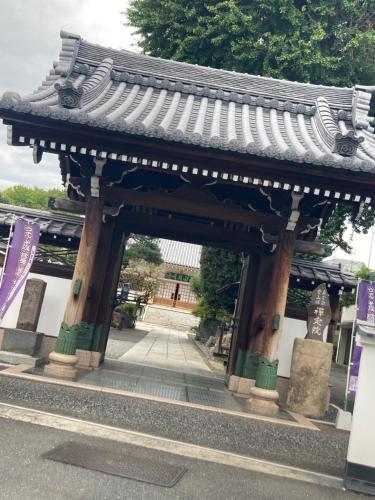an entrance to a building with a roof at B&K Numabukuro in Tokyo