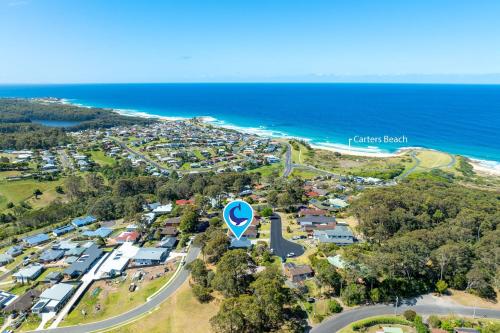 an aerial view of a town next to the ocean at 9 Woods Place, North Narooma in Kianga