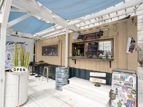 a fast food restaurant with a sign that reads open at Tabist Pension Third Place in Ichinomiya