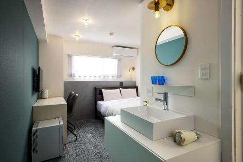 Postel nebo postele na pokoji v ubytování Hotel WWJ