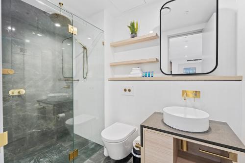 a bathroom with a sink and a shower at Ocean Surfers Paradise - gclr in Gold Coast