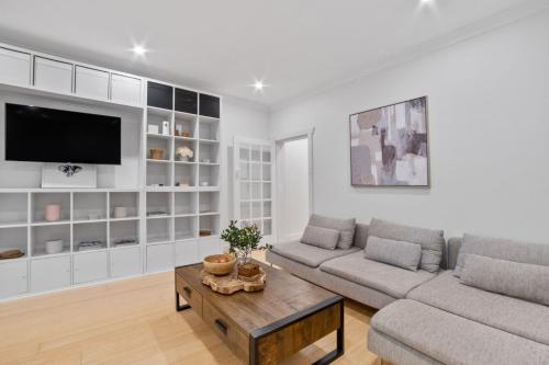 a living room with a couch and a table at Pet-Friendly Home Just Minutes from Bondi Beach in Sydney
