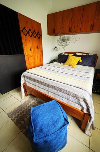 a bedroom with a large bed with a wooden headboard at Designer-inspired 1bed1bath Condo Close To Beach in Coco