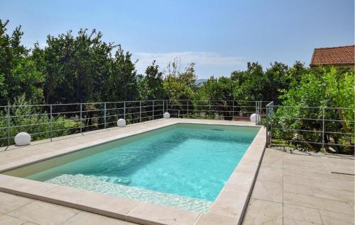 a swimming pool in the backyard of a house at Amazing Home In Giungano With Wifi in Giungano