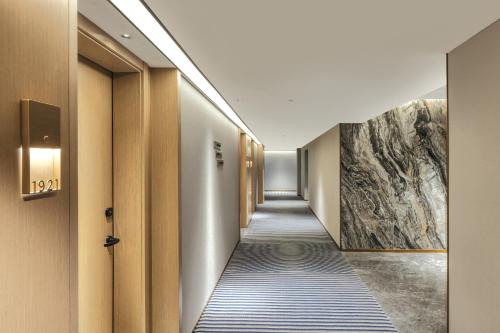Galeriebild der Unterkunft Echarm Plus Hotel - Xi'an Daminggong West Subway Station in Xi'an