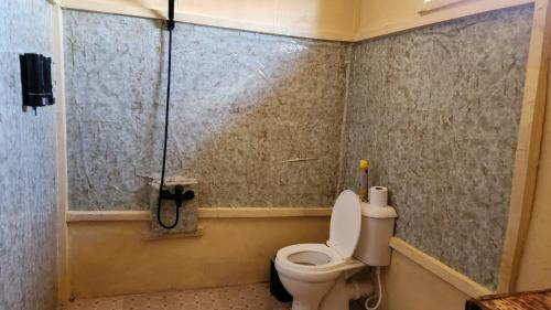 a bathroom with a toilet and a shower at Amanya 2 Bedroom Self Catering Tent in Amboseli
