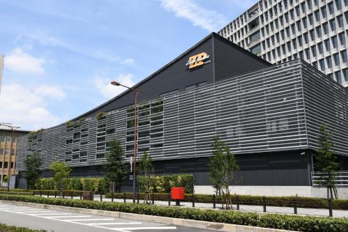 a large black building with a bmw sign on it at Hotel -ASIATO- in Osaka
